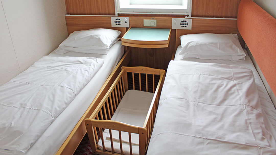 Small carry cot in an on board cabin photo