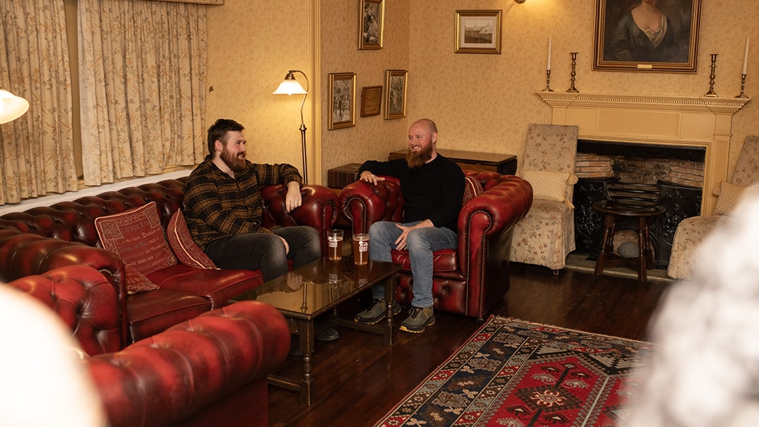 Friends chatting at a pub in Shetland