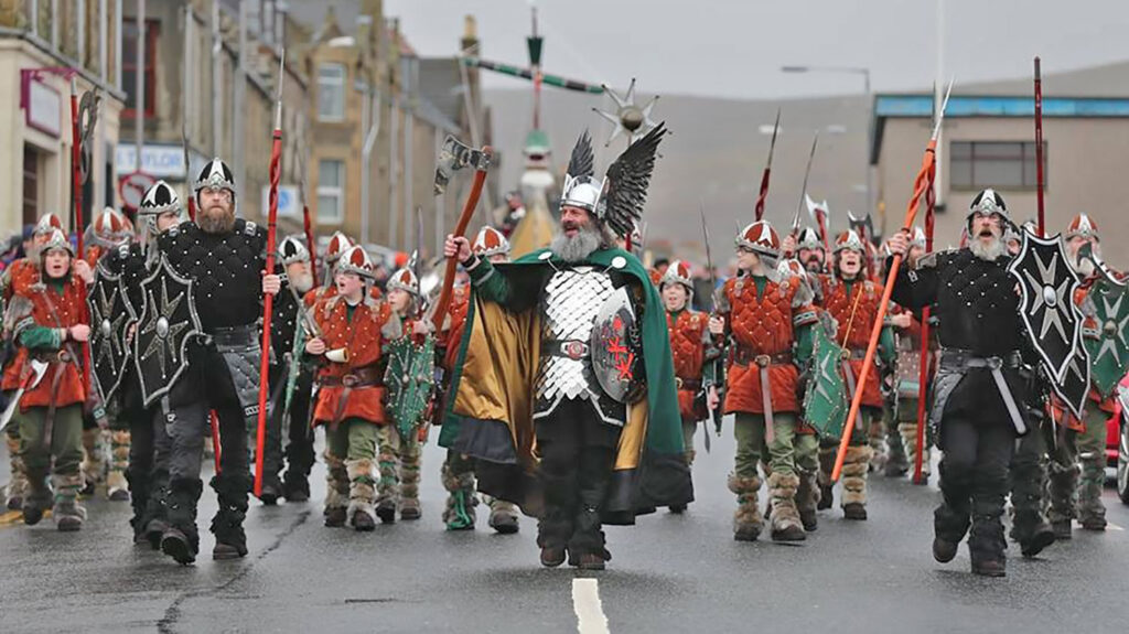 Guizer Jarl Neil Robertson marching through Lerwick
