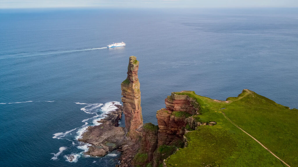 MV Hamnavoe sailing past the Old Man of Hoy in Orkney