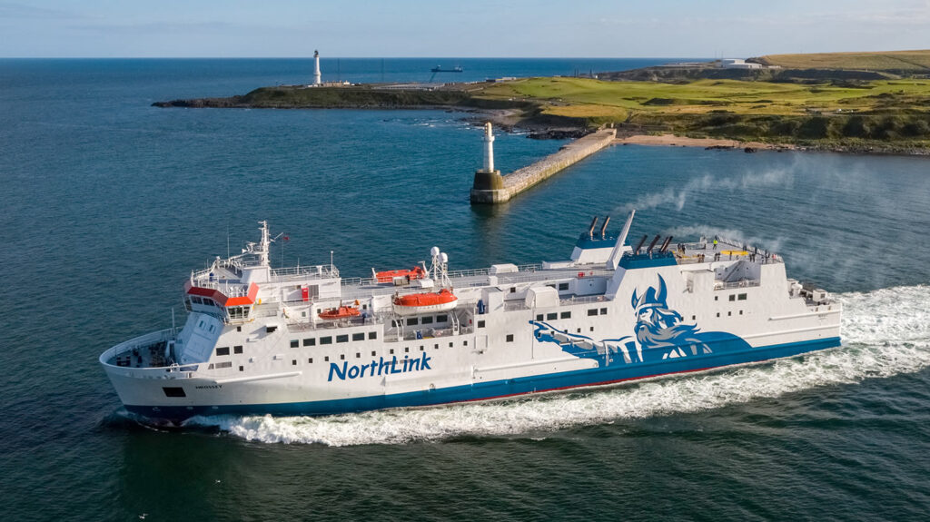 Hrossey sailing out of Aberdeen harbour in the evening