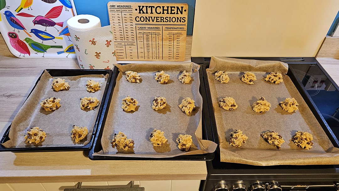 Scoop the cookie dough into small balls on lined baking trays