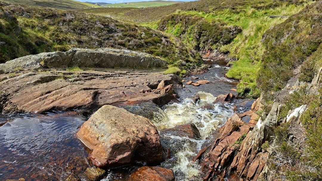 Smooth stones at the top of Burn of Lunklet