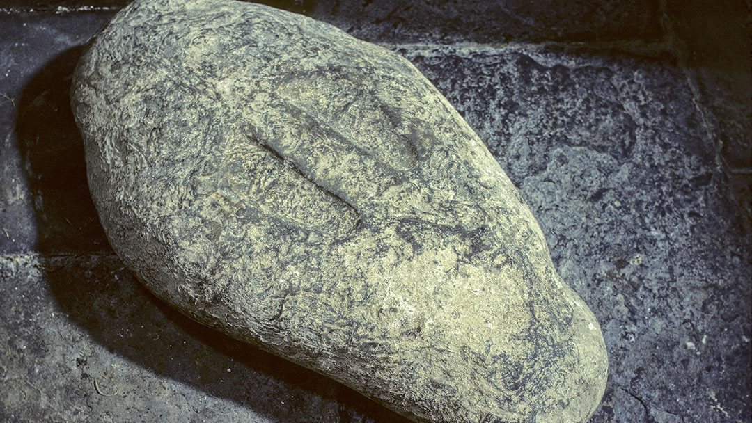 St Marys Chapel stone with footprints, Burwick, South Ronaldsay, Orkney