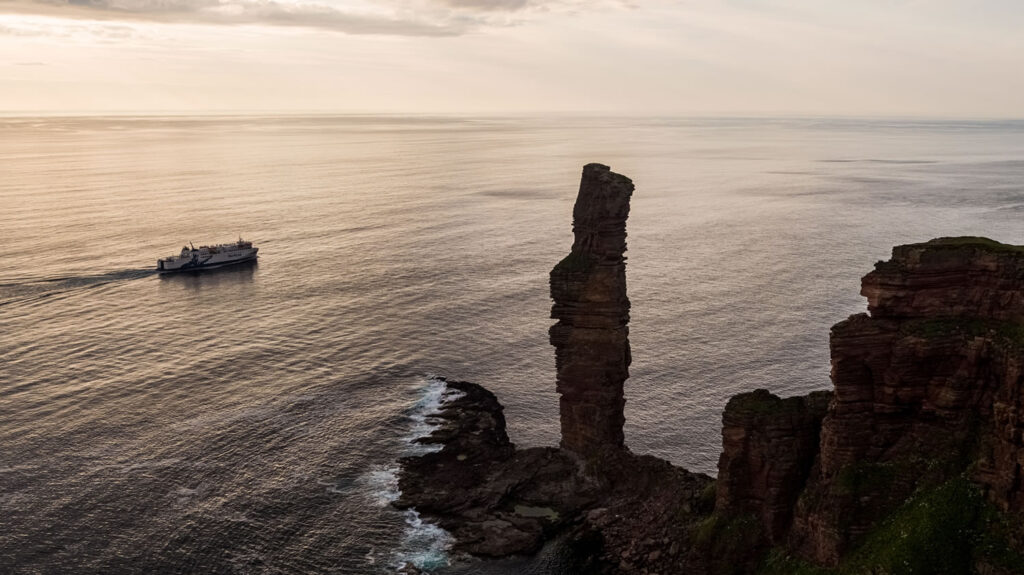 MV Hamnavoe sailing past the Old Man of Hoy in Orkney