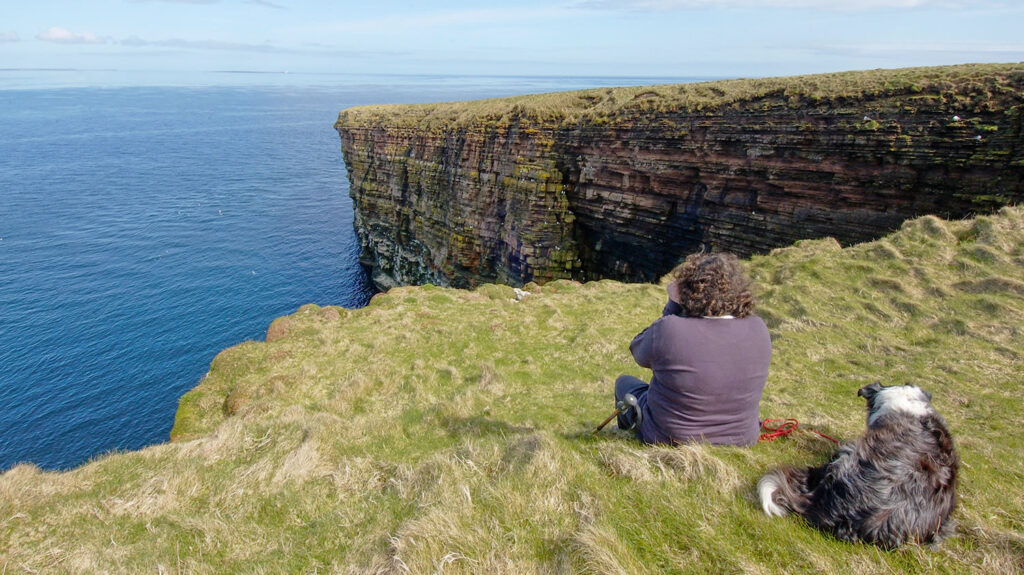 Walking a dog at Mull Head in Deerness, Orkney